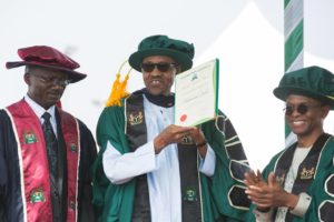 President Buhari being conferred Honorary Doctorate degree of Letters by the Visitor to the Kaduna State University and Governor of Kaduna Nasir El-Rufai, with him is Vice Chancellor of the University Prof. William Barnabas during the 2nd Convocation of the Kaduna State University in Kaduna on 12th Dec 2015